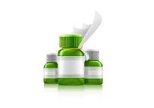 Three green medical bottles with medication